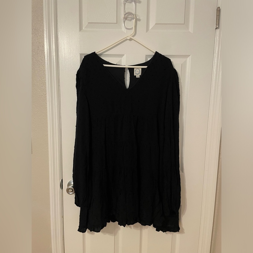 Francesca’s black flowy Blue Rain dress.